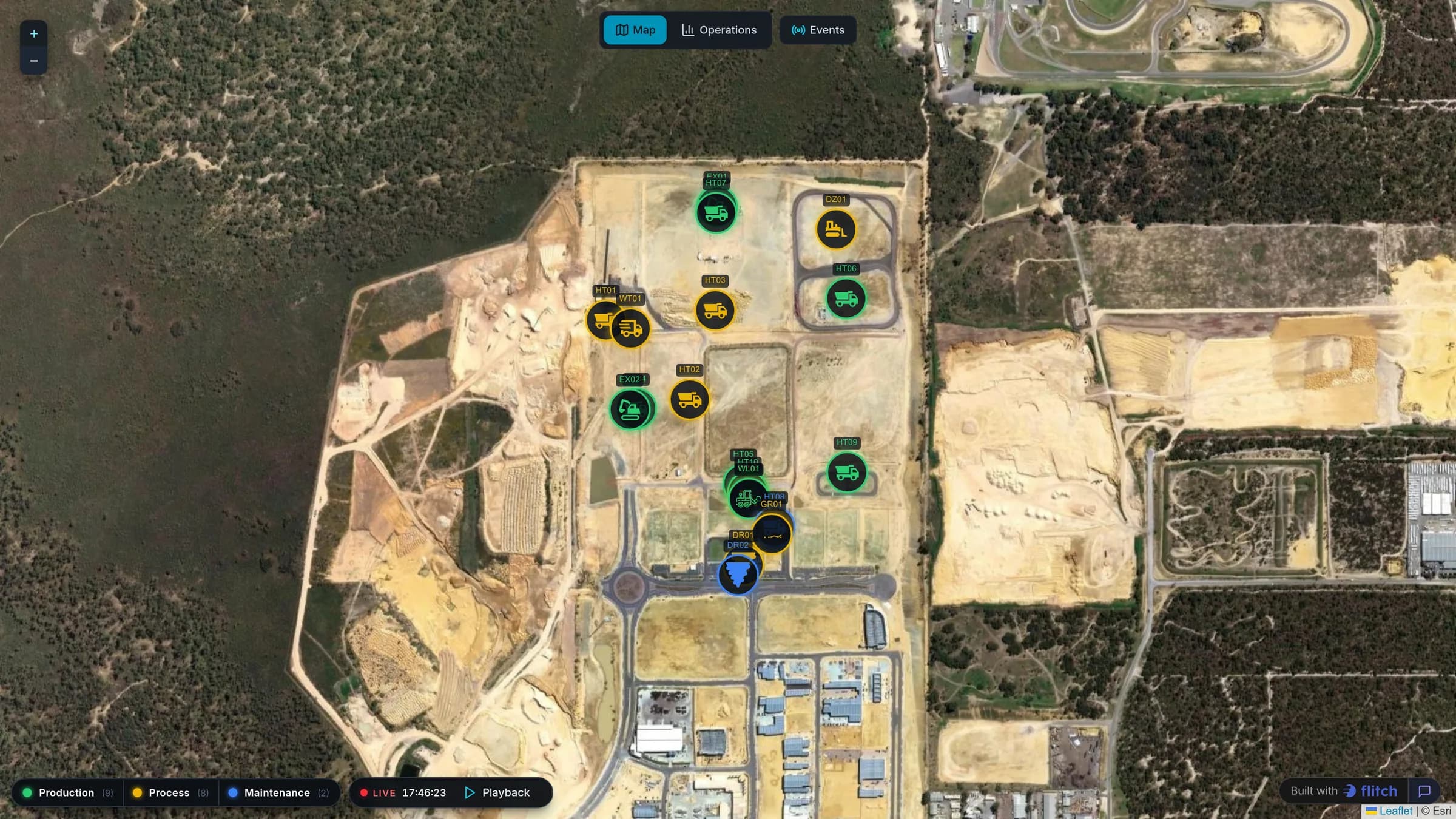 Satellite map of an open-pit mine with haul trucks, excavators and drills marked and colored by status, above a playback bar and a status legend
